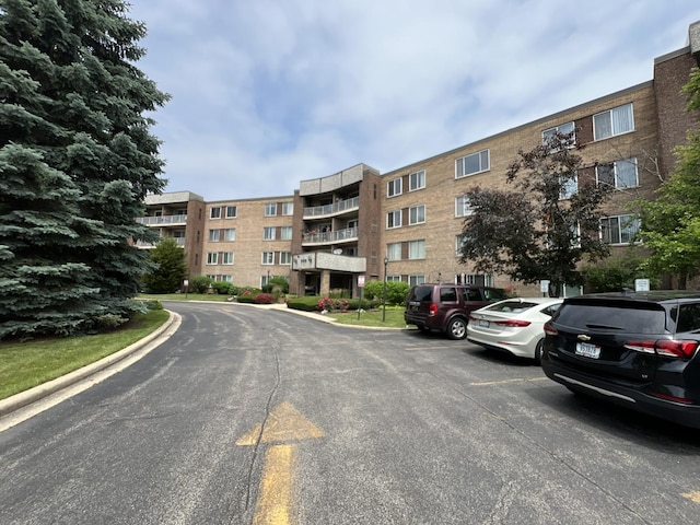 900 E Wilmette Rd Unit 411, Palatine, IL 60074 - view of apartment building / complex featuring uncovered parking