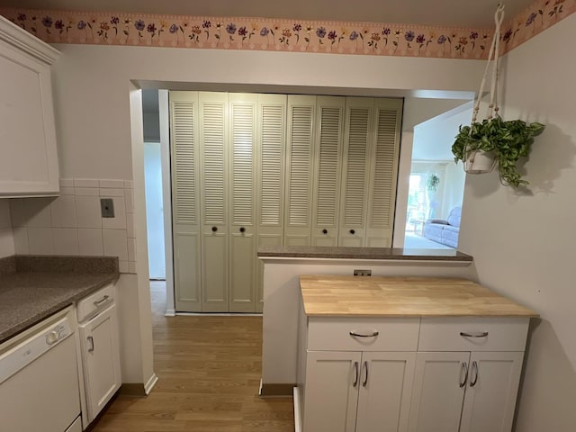 900 E Wilmette Rd Unit 411, Palatine, IL 60074 - kitchen featuring dishwasher, light wood-style floors, wood counters, and white cabinets