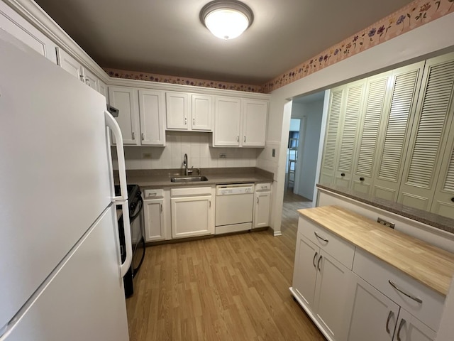 900 E Wilmette Rd Unit 411, Palatine, IL 60074 - kitchen with white appliances, white cabinetry, light wood-style flooring, butcher block counters, and tasteful backsplash