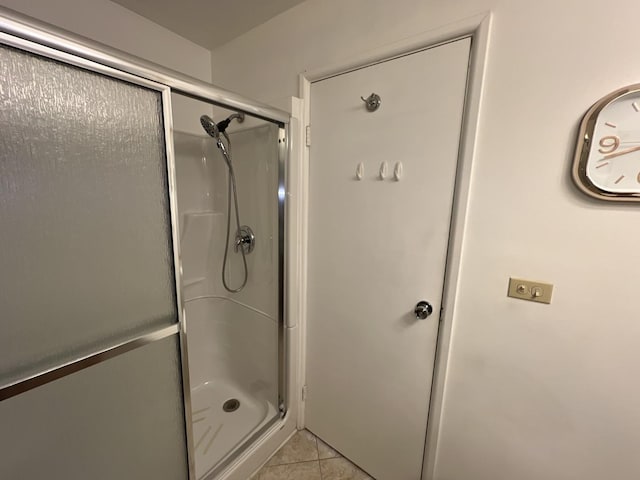 900 E Wilmette Rd Unit 411, Palatine, IL 60074 - full bathroom featuring a stall shower and tile patterned flooring
