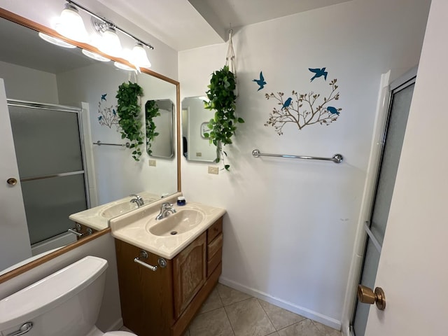 900 E Wilmette Rd Unit 411, Palatine, IL 60074 - bathroom with an enclosed shower, vanity, and tile patterned floors