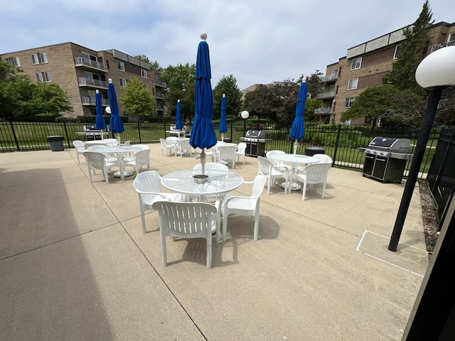 900 E Wilmette Rd Unit 411, Palatine, IL 60074 - view of patio featuring a grill and outdoor dining space