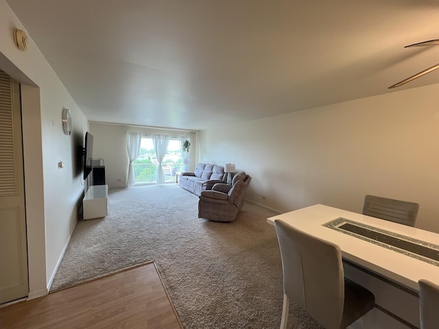 900 E Wilmette Rd Unit 411, Palatine, IL 60074 - carpeted living area with wood finished floors and ceiling fan