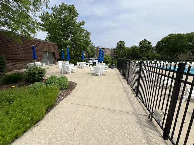900 E Wilmette Rd Unit 411, Palatine, IL 60074 - view of patio / terrace featuring outdoor dining space and a community pool