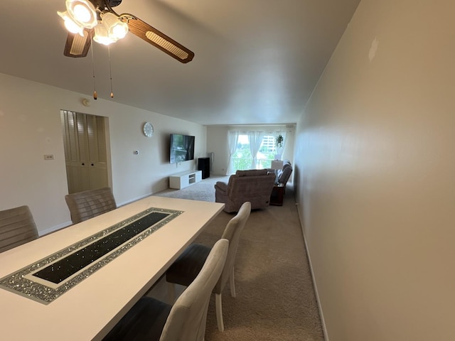900 E Wilmette Rd Unit 411, Palatine, IL 60074 - carpeted dining space featuring a ceiling fan