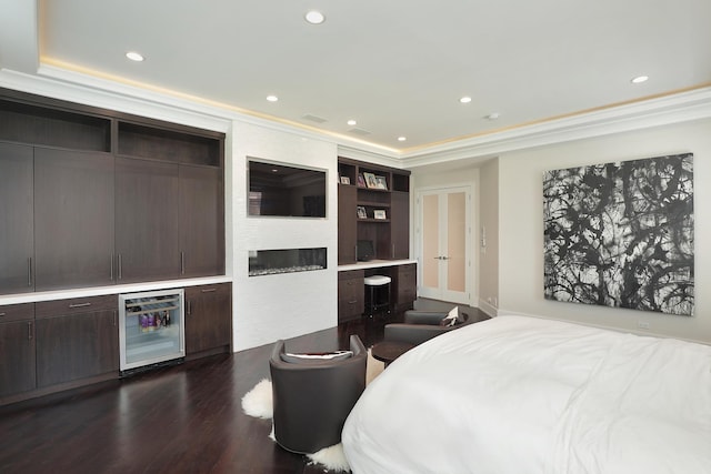 1630 Ridge Rd, Highland Park, IL 60035 - bedroom featuring beverage cooler, recessed lighting, dark wood finished floors, a large fireplace, and crown molding