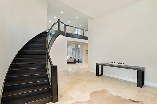1630 Ridge Rd, Highland Park, IL 60035 - stairs featuring tile patterned flooring, recessed lighting, and a high ceiling