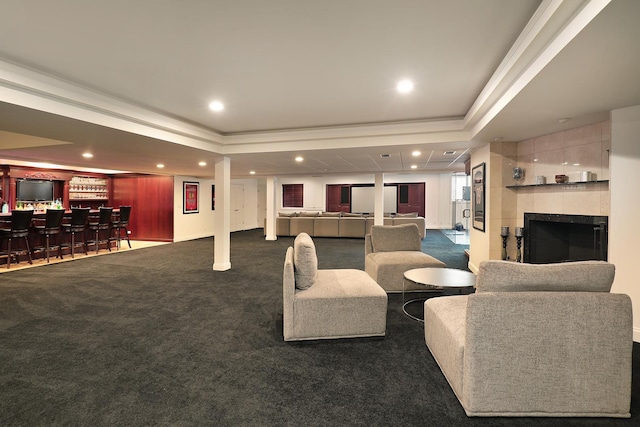 1630 Ridge Rd, Highland Park, IL 60035 - carpeted living area with a community bar, a raised ceiling, recessed lighting, ornamental molding, and a tile fireplace