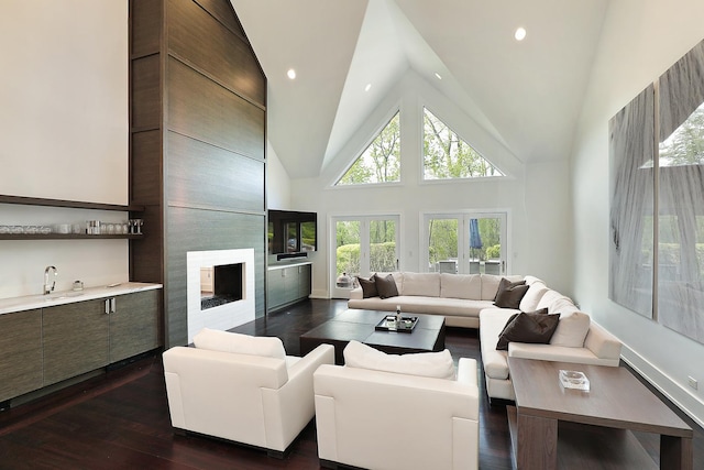 1630 Ridge Rd, Highland Park, IL 60035 - living room featuring dark wood-style floors, bar with sink, a fireplace, high vaulted ceiling, and recessed lighting