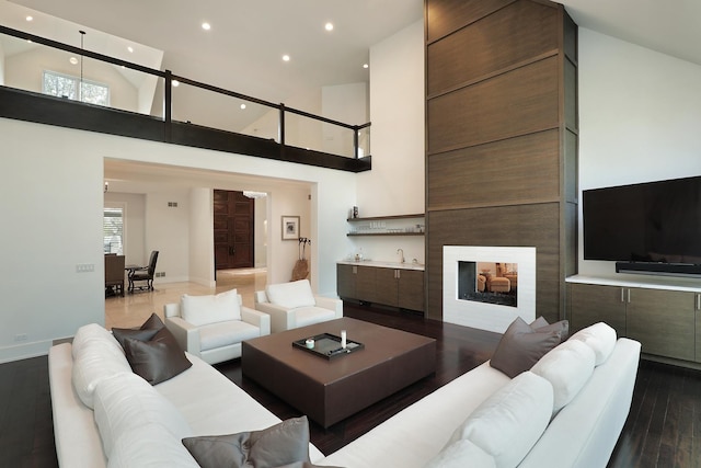 1630 Ridge Rd, Highland Park, IL 60035 - living room with dark wood finished floors, recessed lighting, a high ceiling, and wet bar