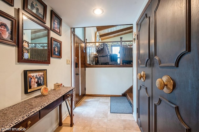4841 W Lunt Ave, Lincolnwood, IL 60712 - doorway to outside featuring baseboards and lofted ceiling