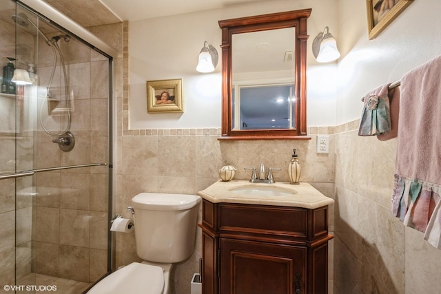 4841 W Lunt Ave, Lincolnwood, IL 60712 - bathroom with tile walls, vanity, a shower stall, and a wainscoted wall