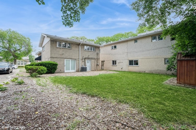 4841 W Lunt Ave, Lincolnwood, IL 60712 - rear view of property with a yard and brick siding