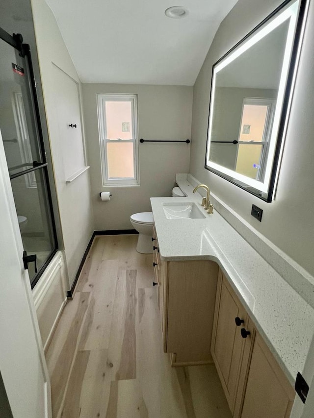 4021 W Estes Ave, Lincolnwood, IL 60712 - full bath with vanity, wood finished floors, and vaulted ceiling
