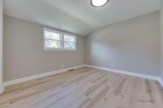 4021 W Estes Ave, Lincolnwood, IL 60712 - spare room featuring light wood finished floors and lofted ceiling