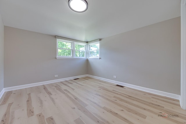 4021 W Estes Ave, Lincolnwood, IL 60712 - spare room with light wood finished floors and baseboards