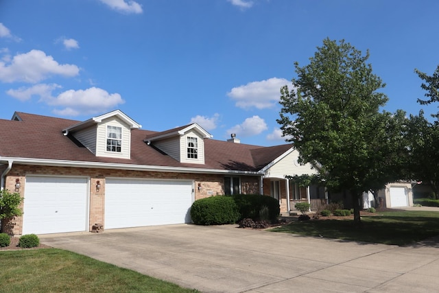 19443 Trenton Way, Mokena, IL 60448 - view of front of home featuring brick siding, driveway, a chimney, and an attached garage
