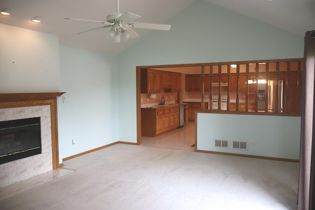 19443 Trenton Way, Mokena, IL 60448 - unfurnished living room featuring light colored carpet, high vaulted ceiling, ceiling fan, and a premium fireplace