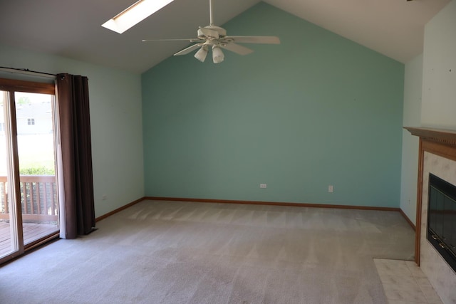 19443 Trenton Way, Mokena, IL 60448 - unfurnished living room with lofted ceiling, a skylight, light colored carpet, a ceiling fan, and a fireplace