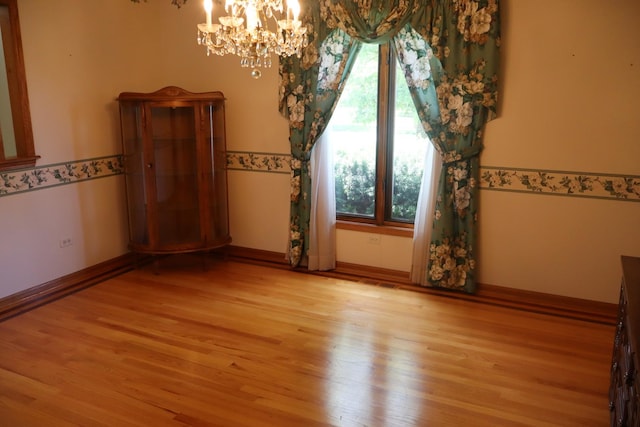 19443 Trenton Way, Mokena, IL 60448 - unfurnished dining area featuring a chandelier and wood finished floors