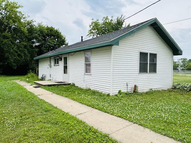 37706 N Nippersink Pl, Spring Grove, IL 60081 - view of side of home featuring a lawn and a shingled roof