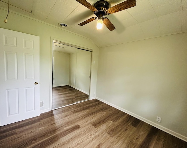37706 N Nippersink Pl, Spring Grove, IL 60081 - unfurnished bedroom featuring wood finished floors, a closet, ceiling fan, and lofted ceiling