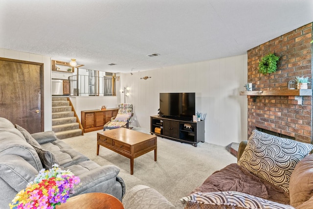 2135 N Haig Ct, Palatine, IL 60074 - carpeted living room with a fireplace, stairs, wood walls, and a textured ceiling