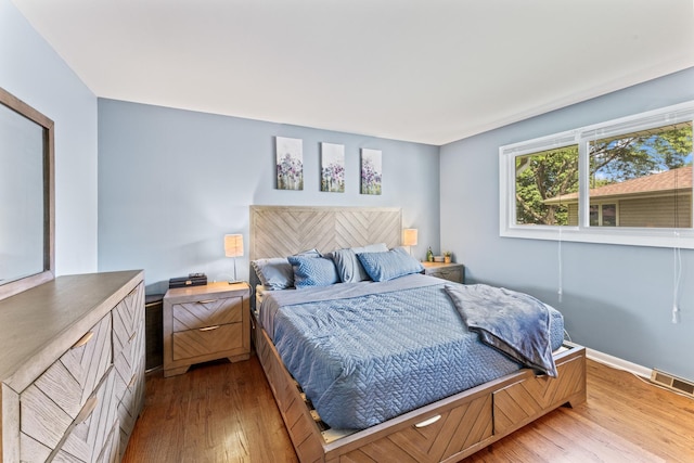 2135 N Haig Ct, Palatine, IL 60074 - bedroom featuring light wood finished floors and baseboards