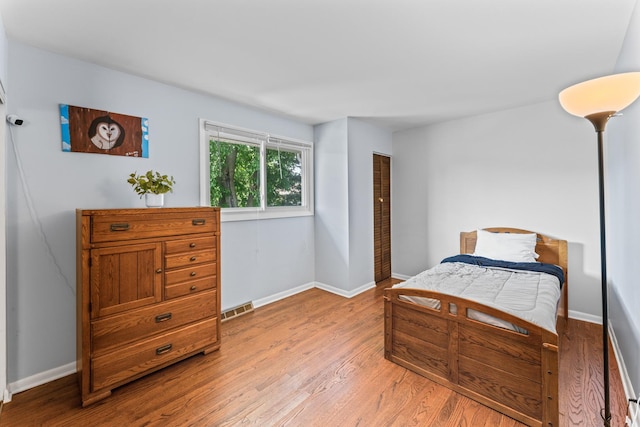 2135 N Haig Ct, Palatine, IL 60074 - bedroom featuring light wood-style flooring and baseboards