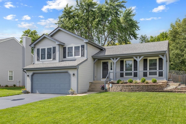 1234 Hillsboro Dr, Batavia, IL 60510 - split level home featuring an attached garage, asphalt driveway, a front yard, a shingled roof, and covered porch