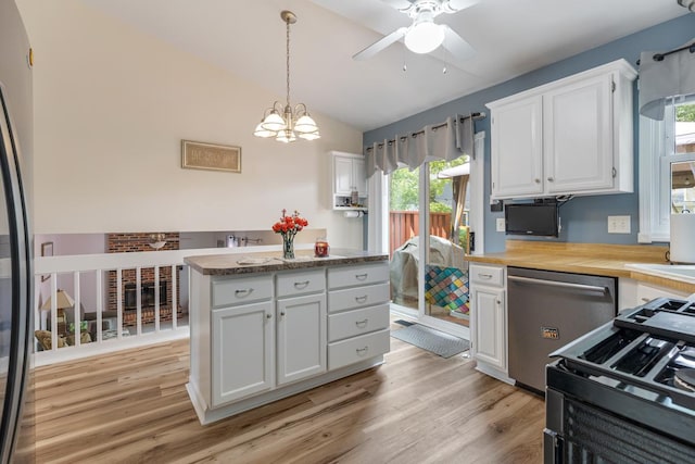 1234 Hillsboro Dr, Batavia, IL 60510 - kitchen featuring stainless steel dishwasher, vaulted ceiling, ceiling fan, white cabinetry, and range with gas stovetop