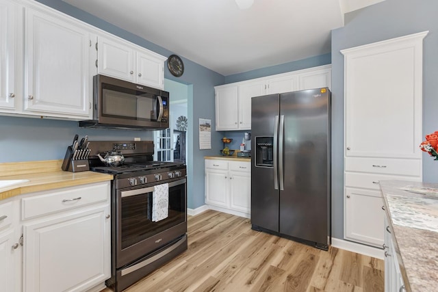 1234 Hillsboro Dr, Batavia, IL 60510 - kitchen featuring appliances with stainless steel finishes, white cabinets, light countertops, and light wood-type flooring