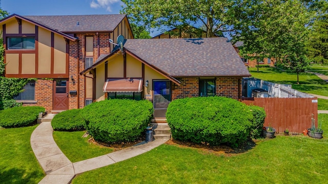 1S222 Danby St, Villa Park, IL 60181 - tudor-style house featuring brick siding, roof with shingles, and stucco siding