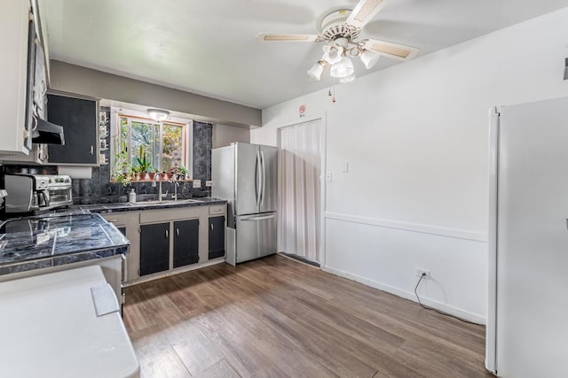 1S222 Danby St, Villa Park, IL 60181 - kitchen with freestanding refrigerator, a ceiling fan, wood finished floors, and backsplash