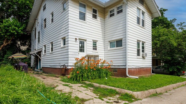 312 N Mclean St, Bloomington, IL 61701 - view of home's exterior with crawl space and cooling unit