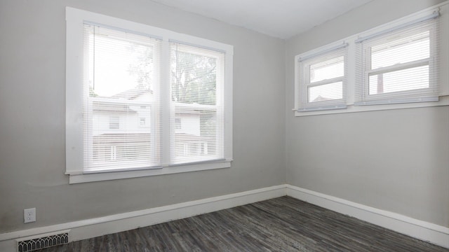 312 N Mclean St, Bloomington, IL 61701 - spare room with dark wood-style flooring and baseboards