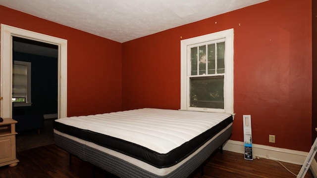 312 N Mclean St, Bloomington, IL 61701 - bedroom with wood finished floors and baseboards