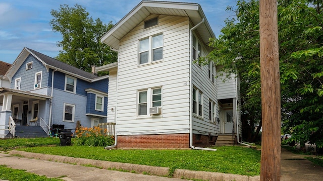 312 N Mclean St, Bloomington, IL 61701 - view of front facade featuring a front lawn, covered porch, crawl space, and cooling unit