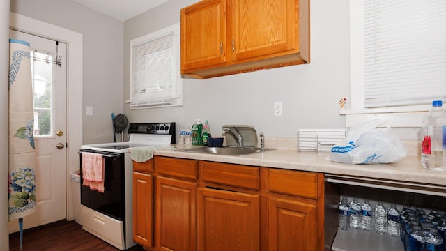 312 N Mclean St, Bloomington, IL 61701 - kitchen with electric stove, wine cooler, light countertops, and brown cabinetry