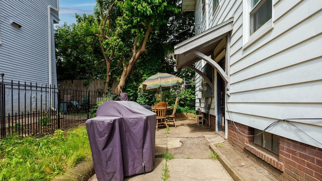 312 N Mclean St, Bloomington, IL 61701 - view of patio featuring a grill