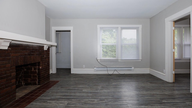 312 N Mclean St, Bloomington, IL 61701 - unfurnished living room with baseboard heating, dark wood-style flooring, and a brick fireplace