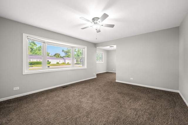 1055 N Bluebonnet Ln, Hoffman Estates, IL 60169 - empty room featuring ceiling fan and dark colored carpet