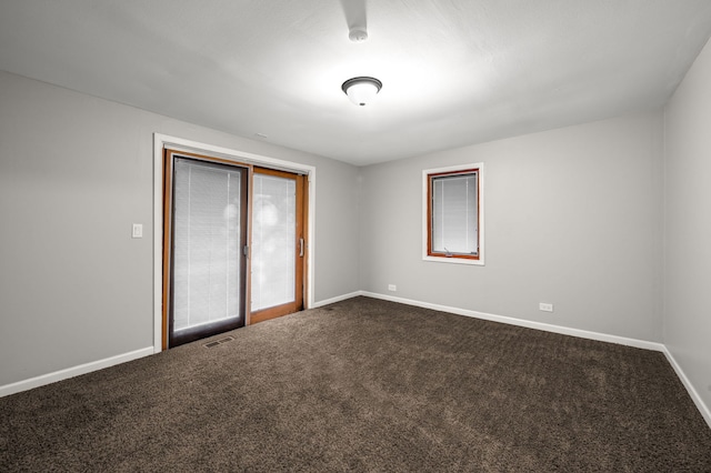 1055 N Bluebonnet Ln, Hoffman Estates, IL 60169 - unfurnished room featuring dark carpet and baseboards