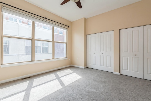 1240 W Monroe St Unit 7, Chicago, IL 60607 - unfurnished bedroom featuring carpet, two closets, and ceiling fan