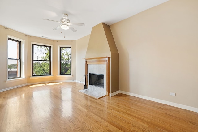 2332 W Huron St Unit 4, Chicago, IL 60612 - unfurnished living room featuring ceiling fan, light wood finished floors, and a fireplace