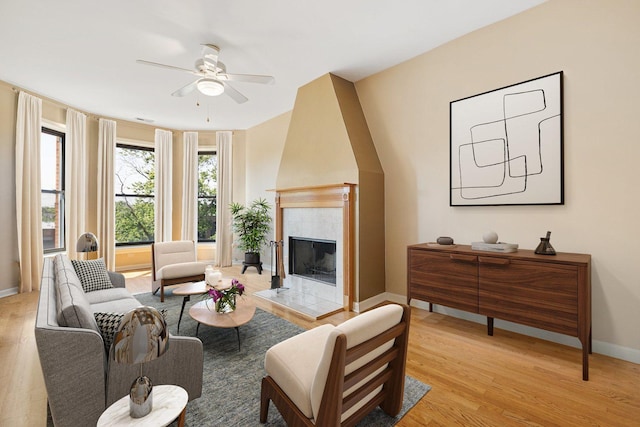 2332 W Huron St Unit 4, Chicago, IL 60612 - living area featuring a ceiling fan, light wood-style flooring, and a tiled fireplace