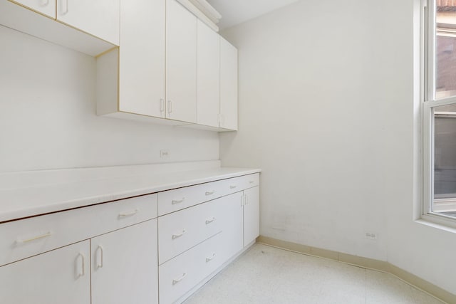 2332 W Huron St Unit 4, Chicago, IL 60612 - interior space with light countertops, white cabinets, and light flooring