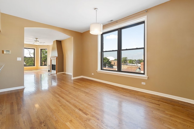 2332 W Huron St Unit 4, Chicago, IL 60612 - spare room with arched walkways, wood finished floors, and ceiling fan