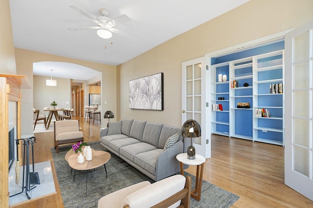 2332 W Huron St Unit 4, Chicago, IL 60612 - living room featuring wood finished floors, arched walkways, and a ceiling fan