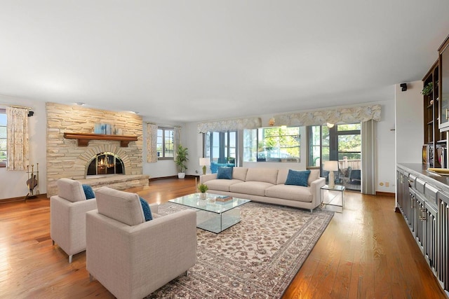 10 Shoreside Dr, South Barrington, IL 60010 - living area with plenty of natural light, light wood-style floors, and a stone fireplace